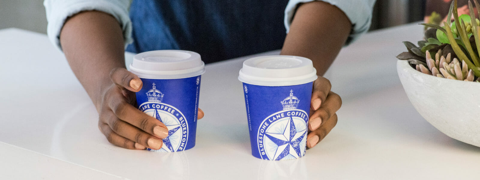 2 Bluestone Lane small takeaway cups.
