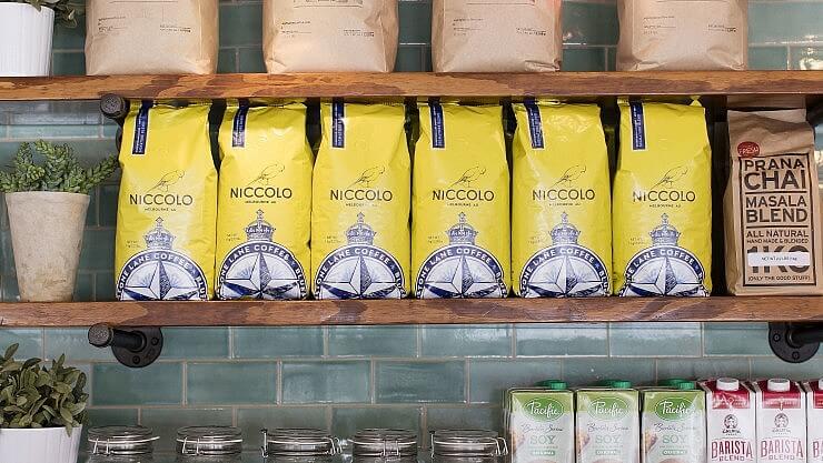 6 Niccolo Coffee bags on shelf. 