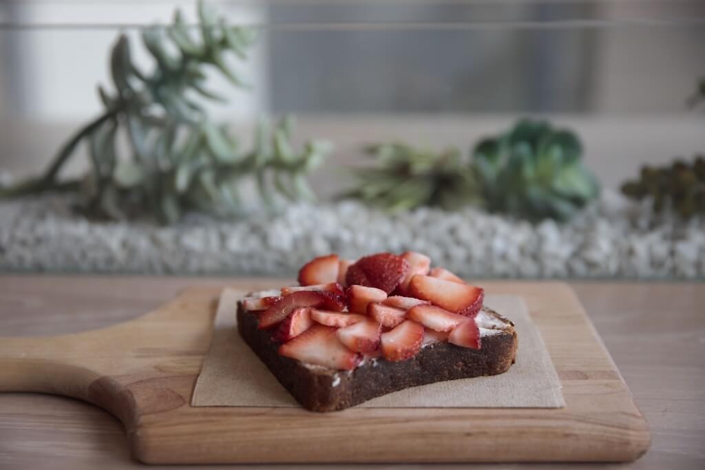 strawberry toast on a board.