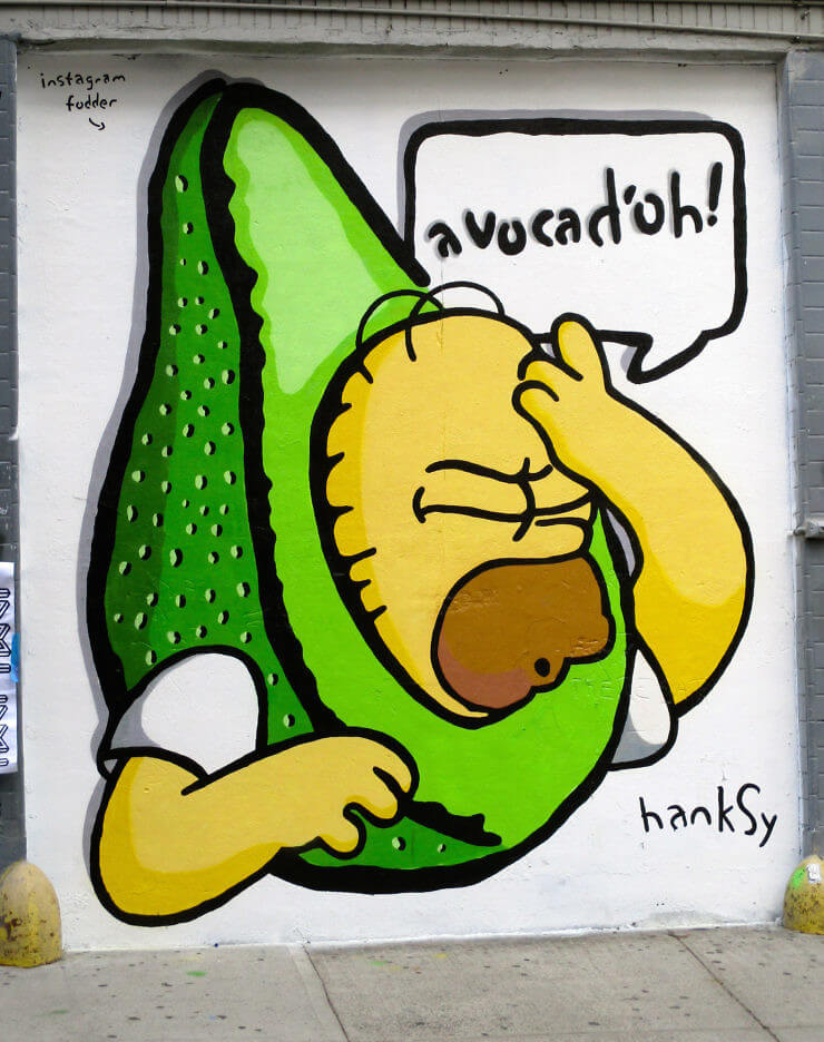 wall art of of an avocado with Homer Simpson saying "avocad'oh!"