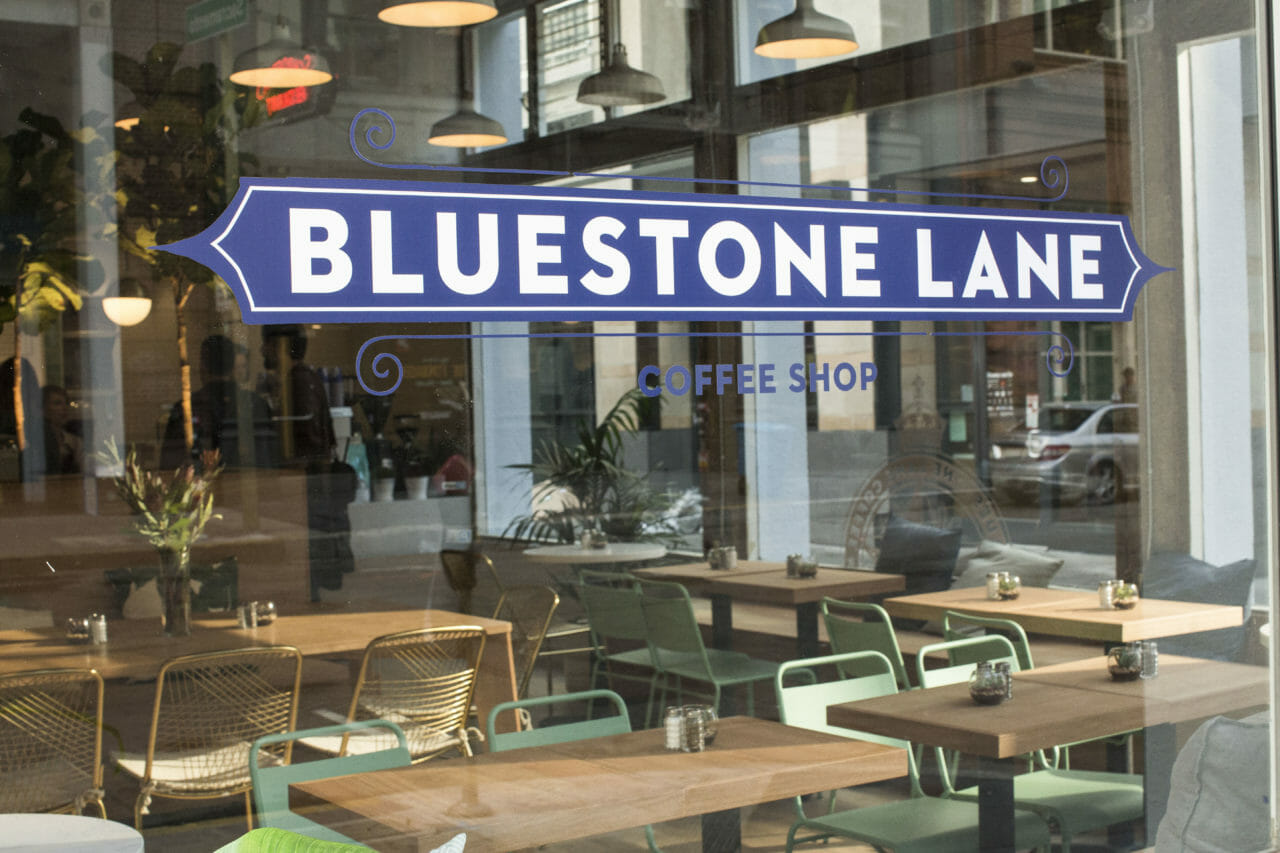 exterior of Bluestone Lane front street with the Bluestone Lane logo.