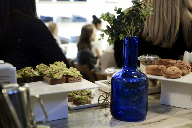 mini avo smashes on table with blue vase and flowers.