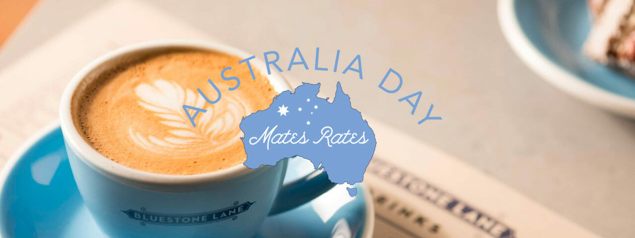 Flat white in a to stay cup with the Australia Day Mates Rates logo.