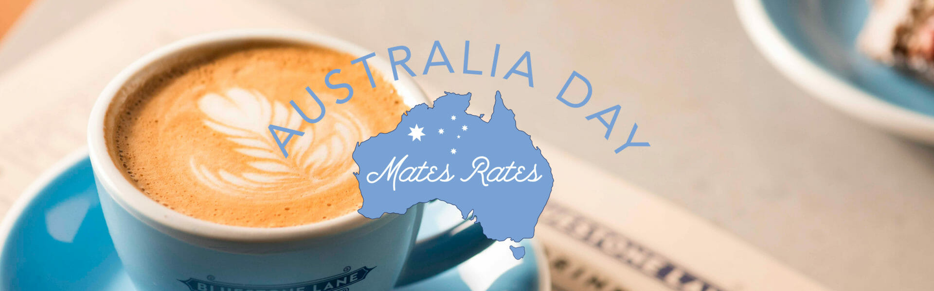 Flat white in a to stay cup with the Australia Day Mates Rates logo.