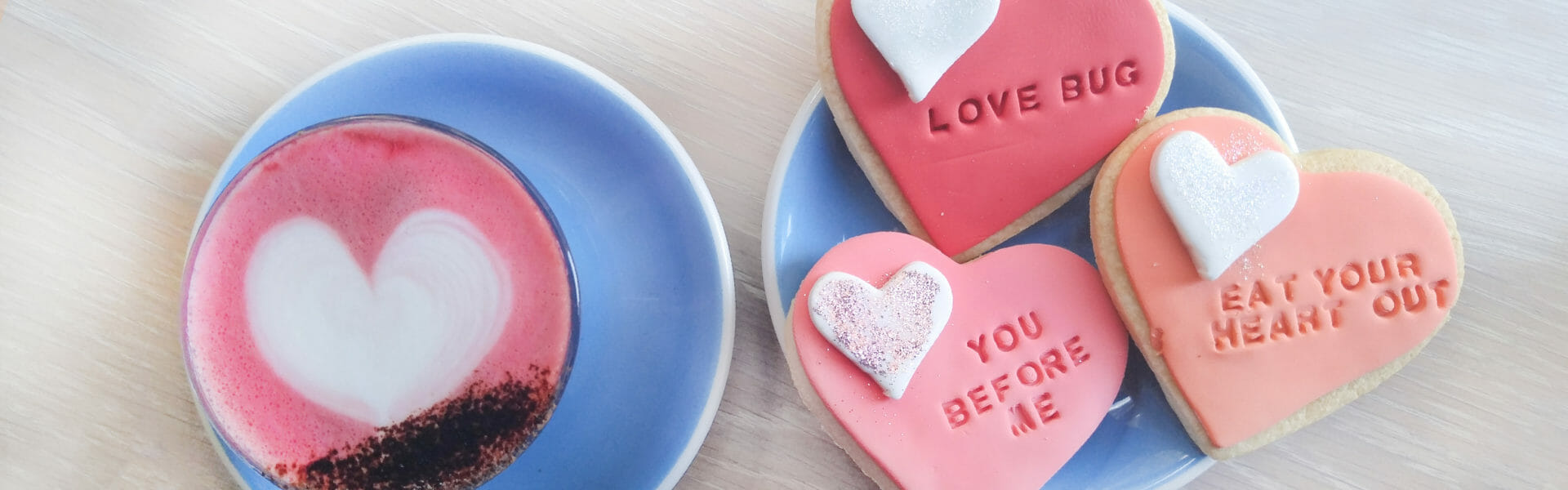 Beet Latte with 3 heart shaped cookies.