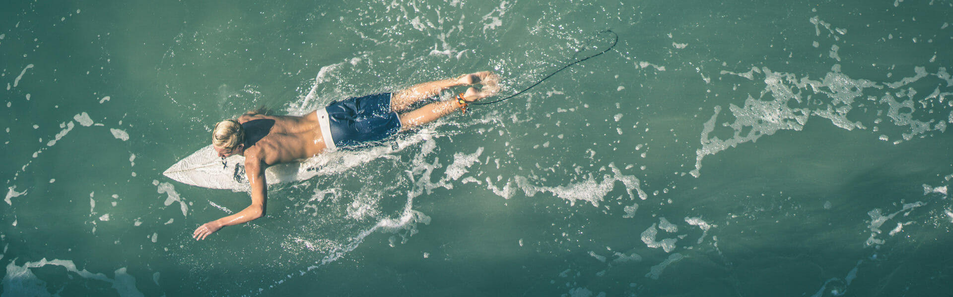 aerial shot of a surfer in the waves.