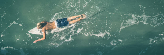aerial shot of a surfer in the waves.