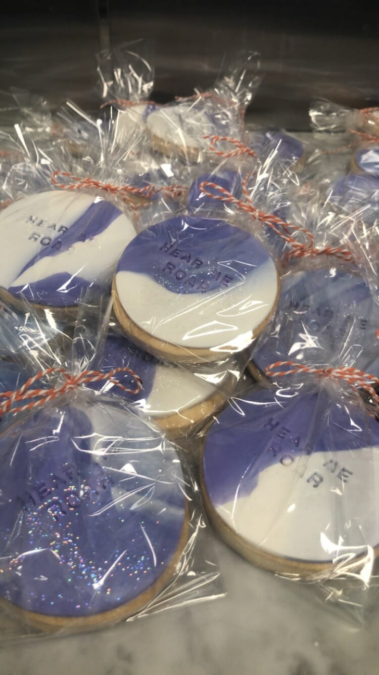 6 purple and white Bespoke cookies on table