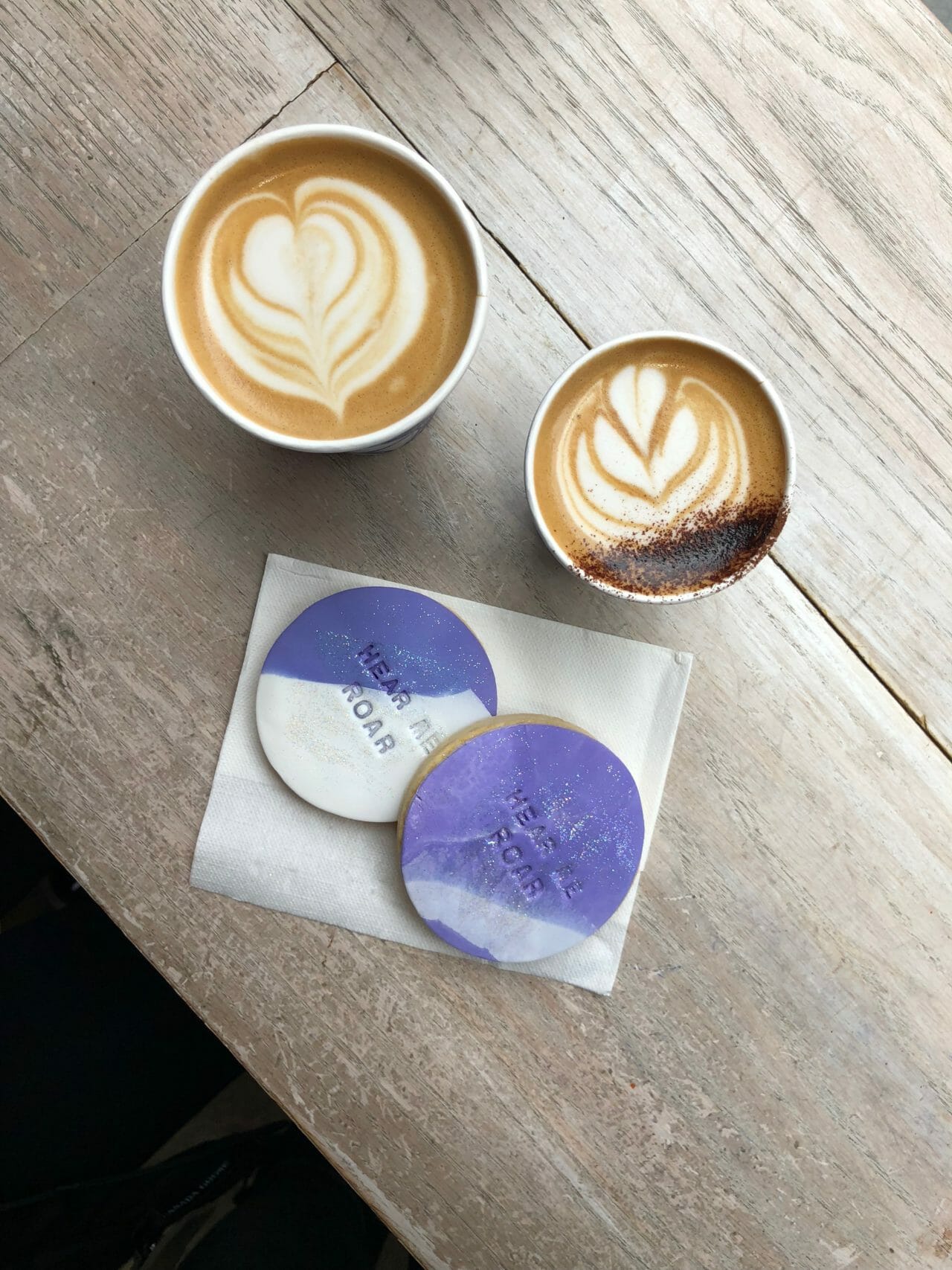 aerial shot of two bespoke cookies and Bluestone Lattes