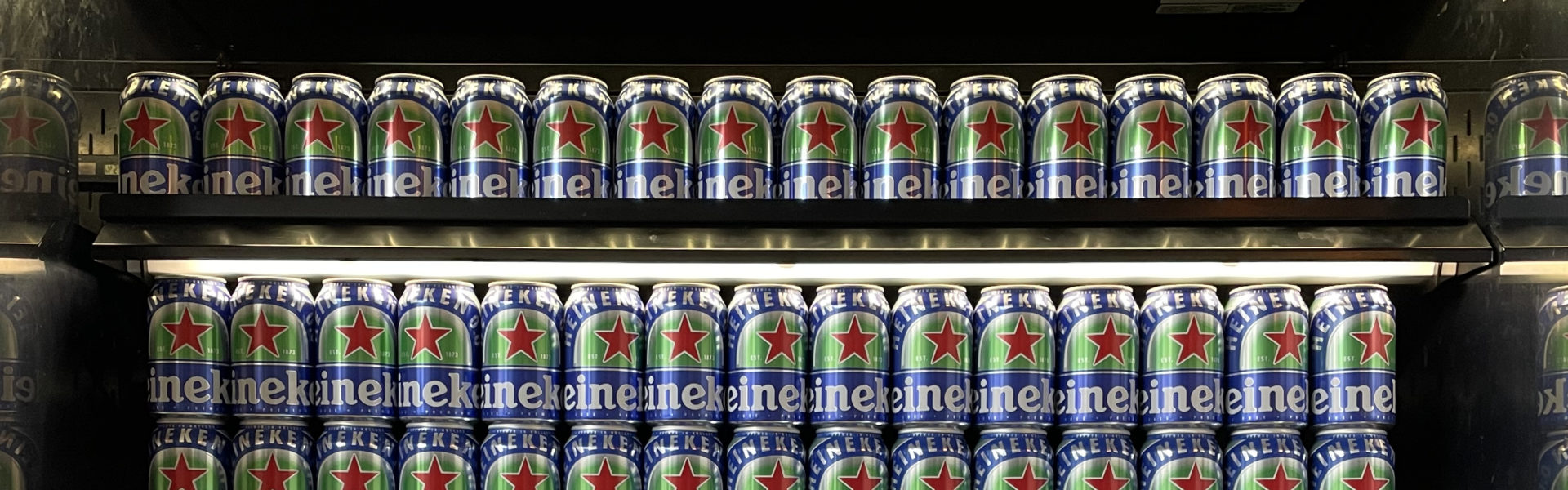 Rows of Heineken beers in fridge